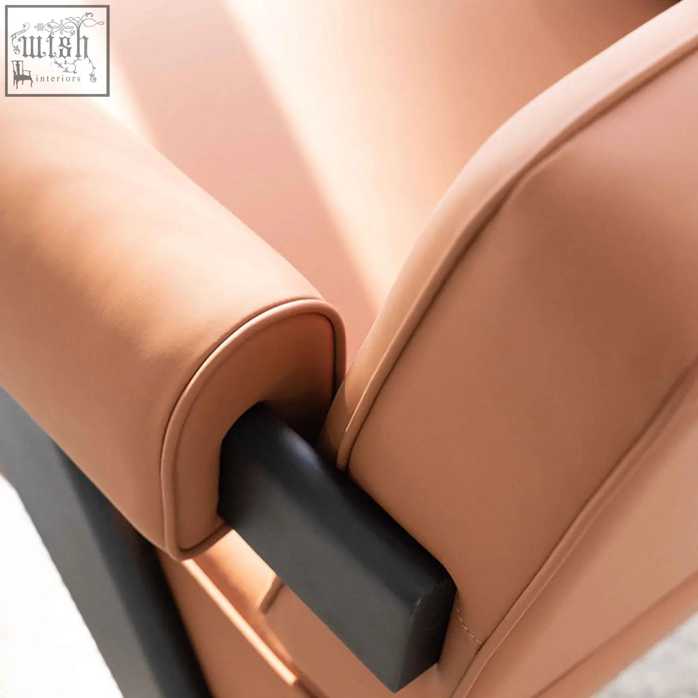 Tan microfiber leather armrest with sleek black rectangular accent on bertran armchair brown