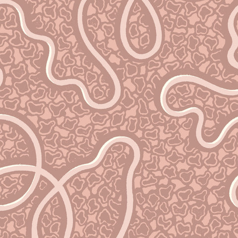 A bespoke 120cm tall piped headboard with soft pink wallpaper and cream abstract swirls in micaela sharp collaboration