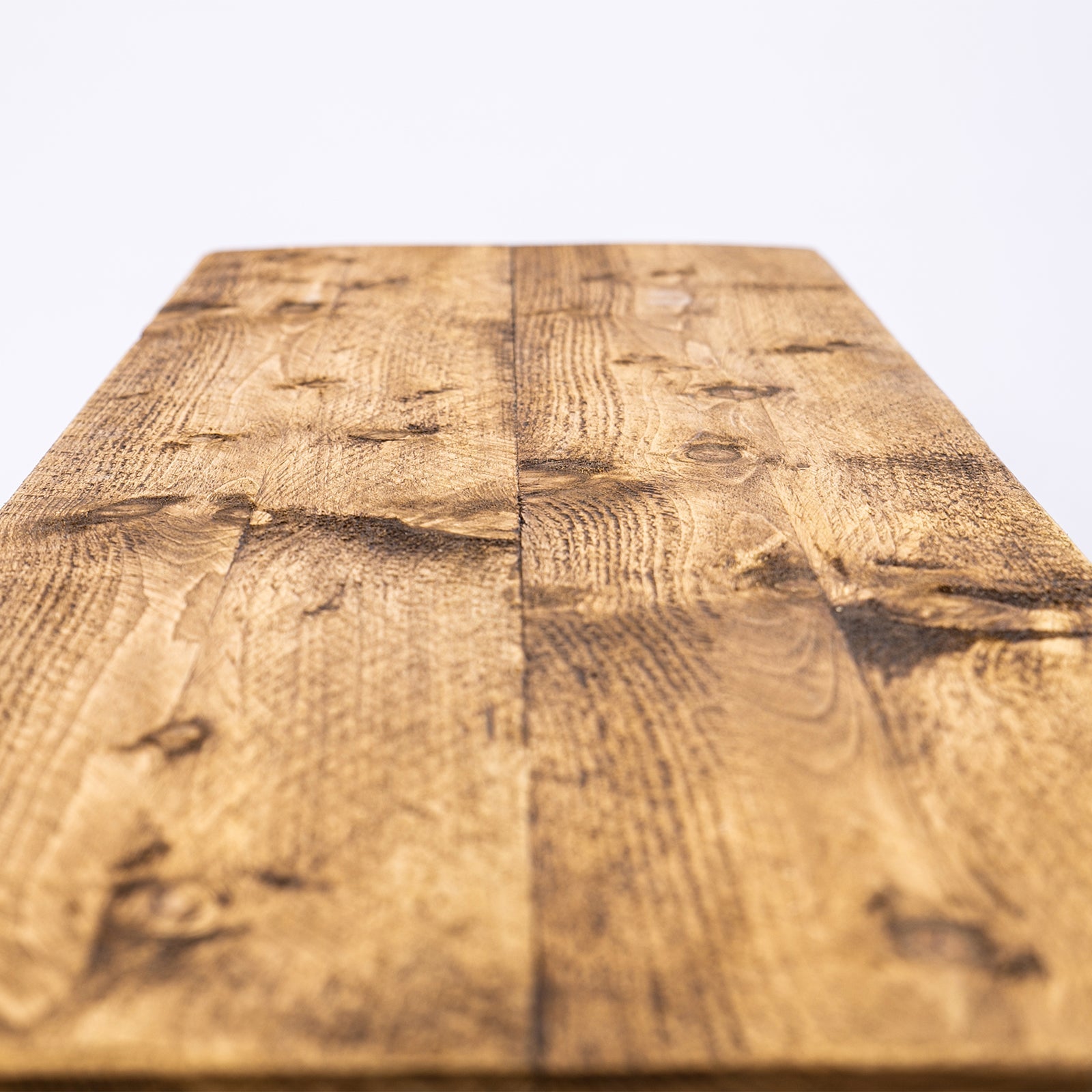 Bespoke solid wooden bench with reclaimed wood tabletop and industrial steel hairpin legs in warm rustic finish free uk delivery