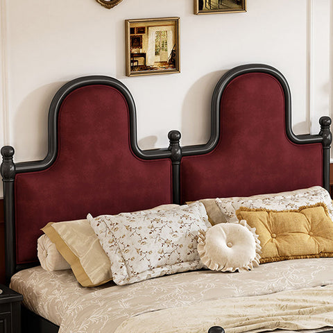 The betty king size bed features a rich burgundy velvet headboard with a black wrought iron arch frame king size style