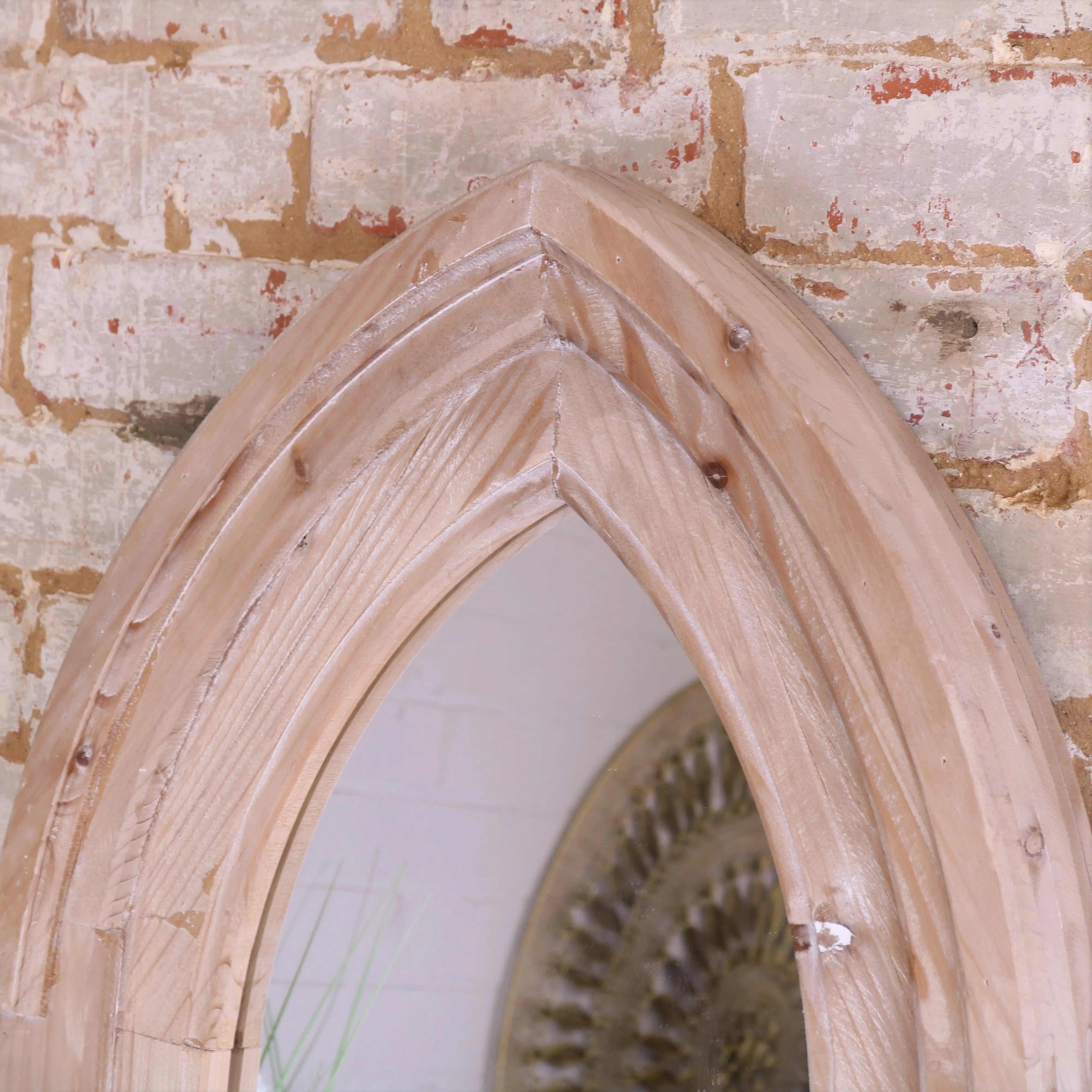 Betul full size wooden arch mirror with rustic light wood color and visible grain in a gothic arch mirror design