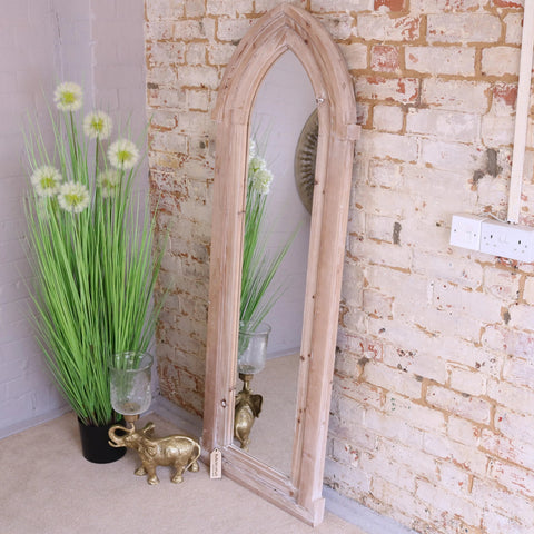 Betul full size wooden arch mirror with a tall rustic wooden arch frame and visible wood grain finish