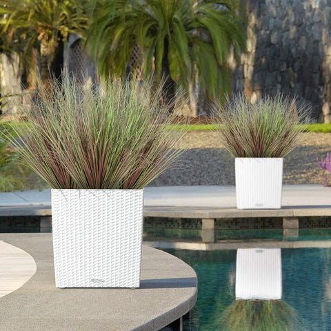 White woven wicker planter with green and brown tall feathery faux plants from betylifoy artificial plants set