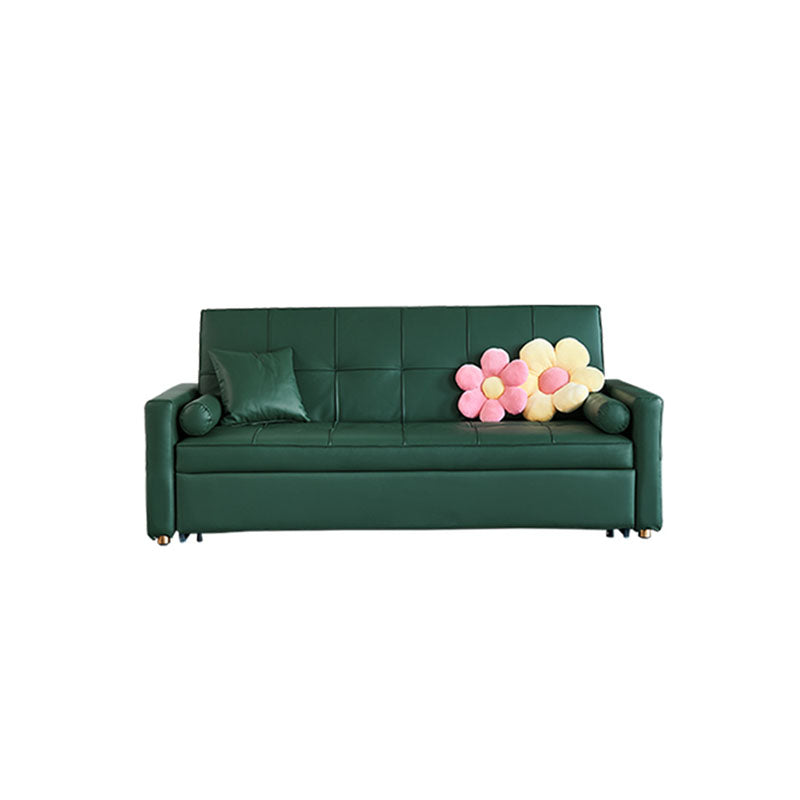 Deep green tufted leathaire bh155 three seater sofa bed with floral pillow arrangement and soft upholstery