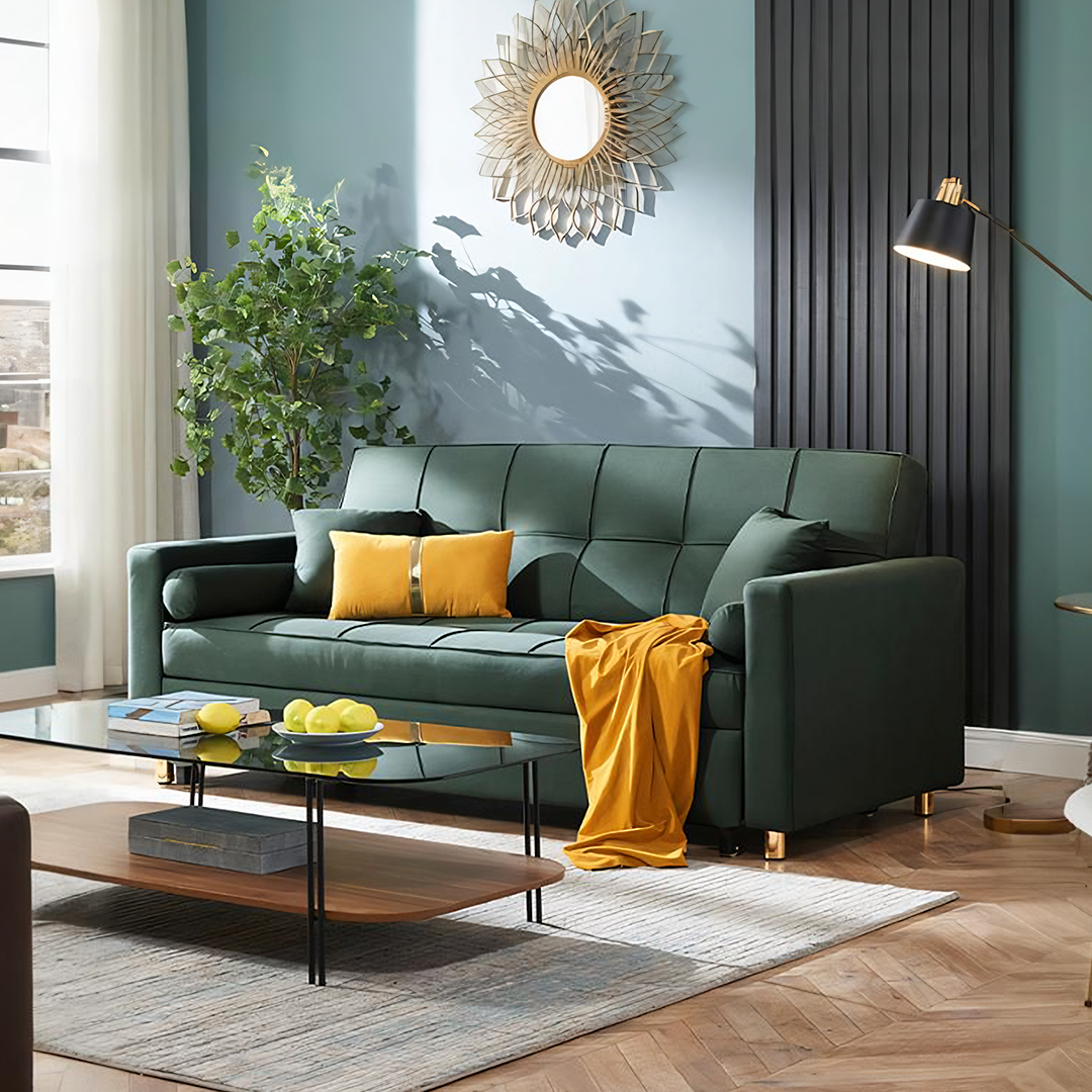 Bh155 three seater sofa bed in emerald green tufted fabric with gold-tone legs and mustard yellow throw pillows