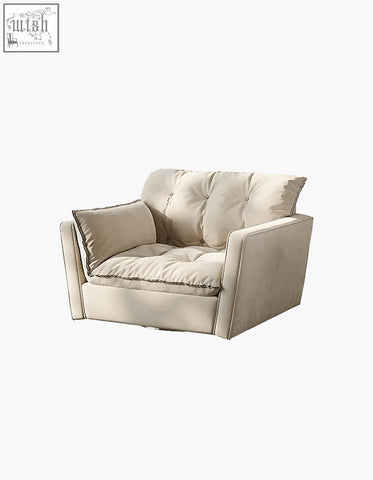 Beige tufted bhatia swivel snuggle chair with soft cushioning and matching throw pillow for cozy seating