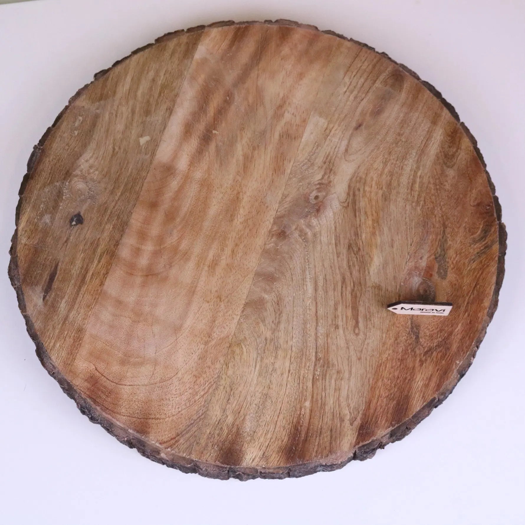 Natural wood round wooden chopping board with rustic bark edge and visible grain pattern 42cm bhimra