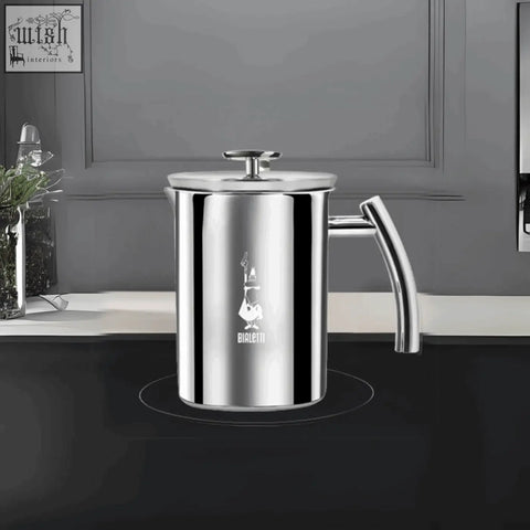 Shiny stainless steel bialetti manual milk frother with sleek curved handle and lid for perfect frothing