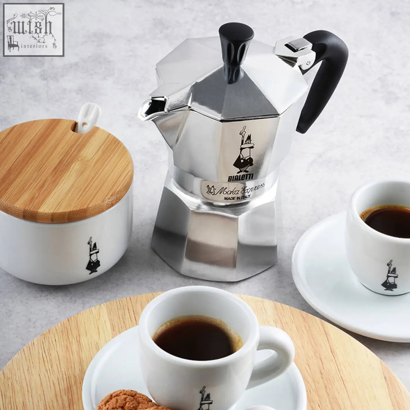Silver octagonal bialetti moka express coffee maker with black handle and knob for rich espresso brewing