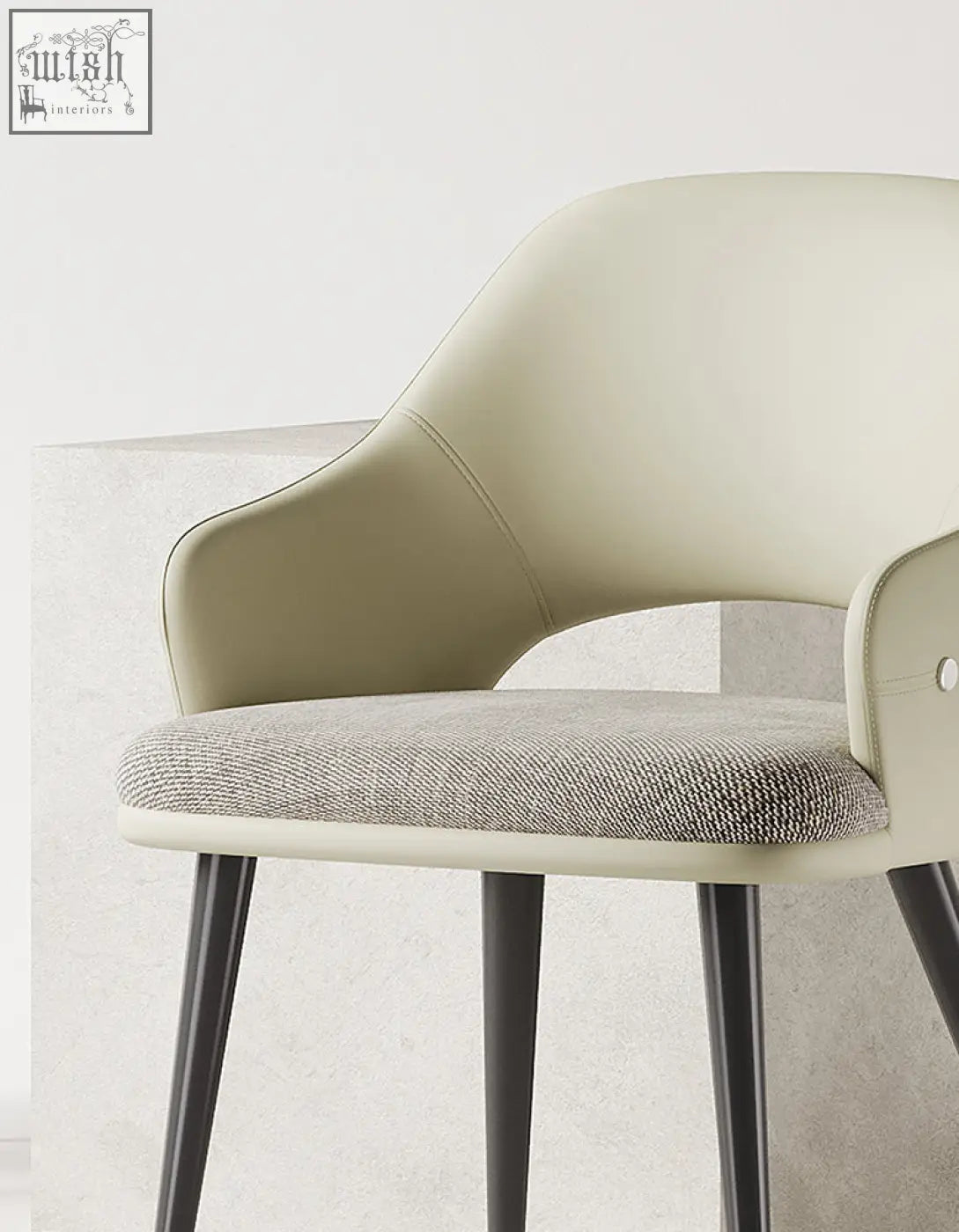 Cream-colored leather bianchi dining chair with textured gray fabric seat and black metal legs perfect for dining room