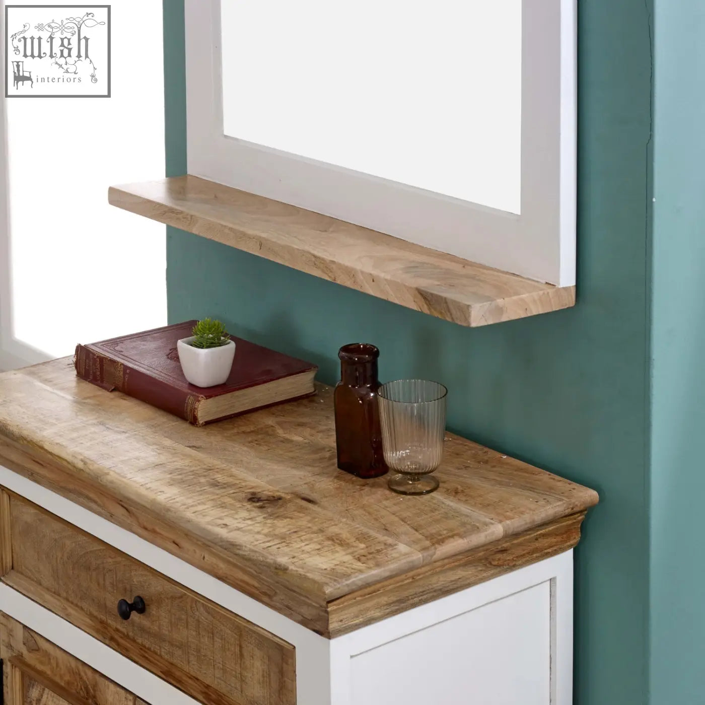 Rustic wooden shelf with natural grain and knots mounted above a white solid mango wood sideboard cabinet