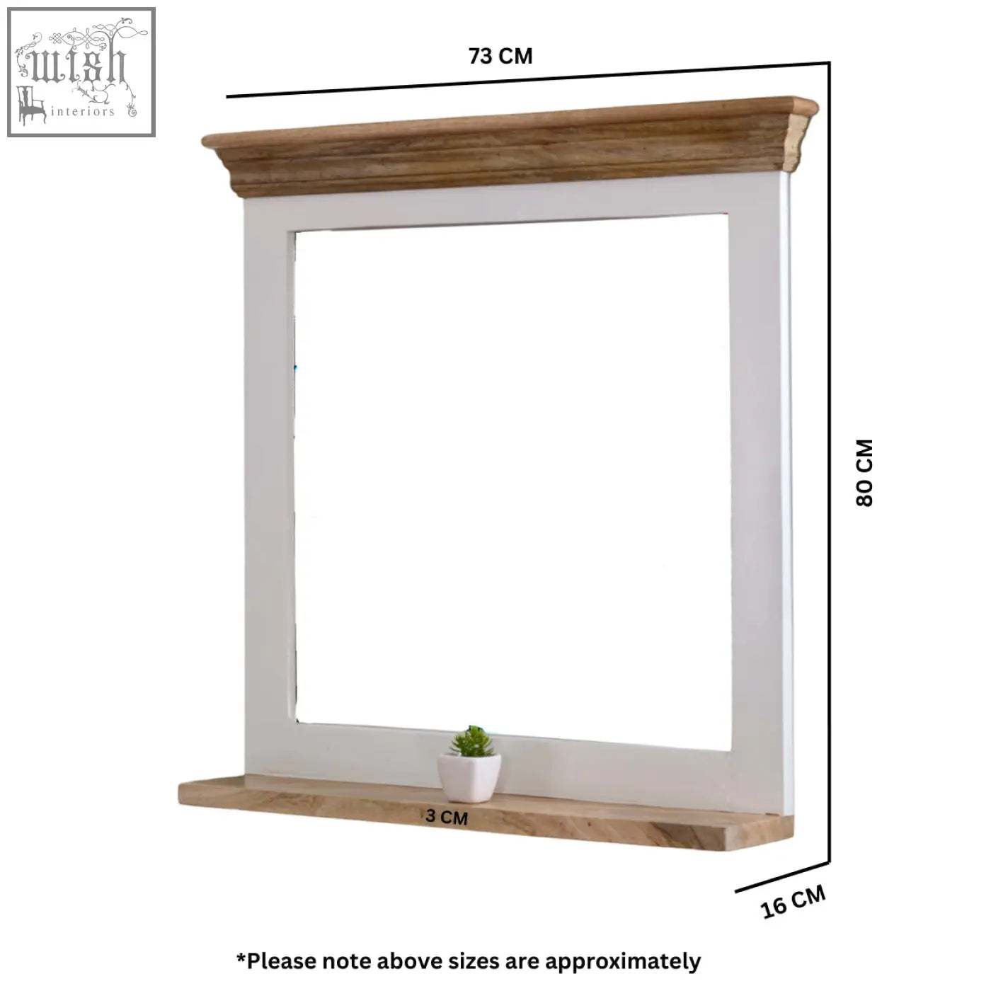 White framed bianco solid mango wood wall mirror with natural wood crown and base featuring a potted succulent