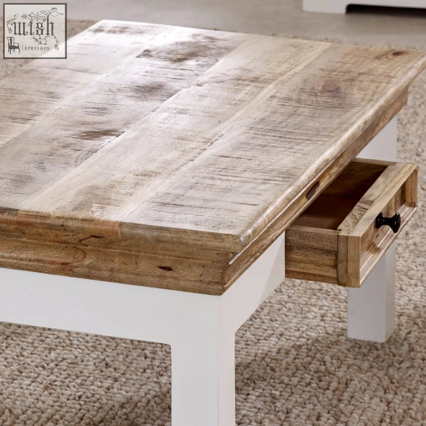 Bianco solid mango wood coffee table with white painted base and single drawer with black knob for living room