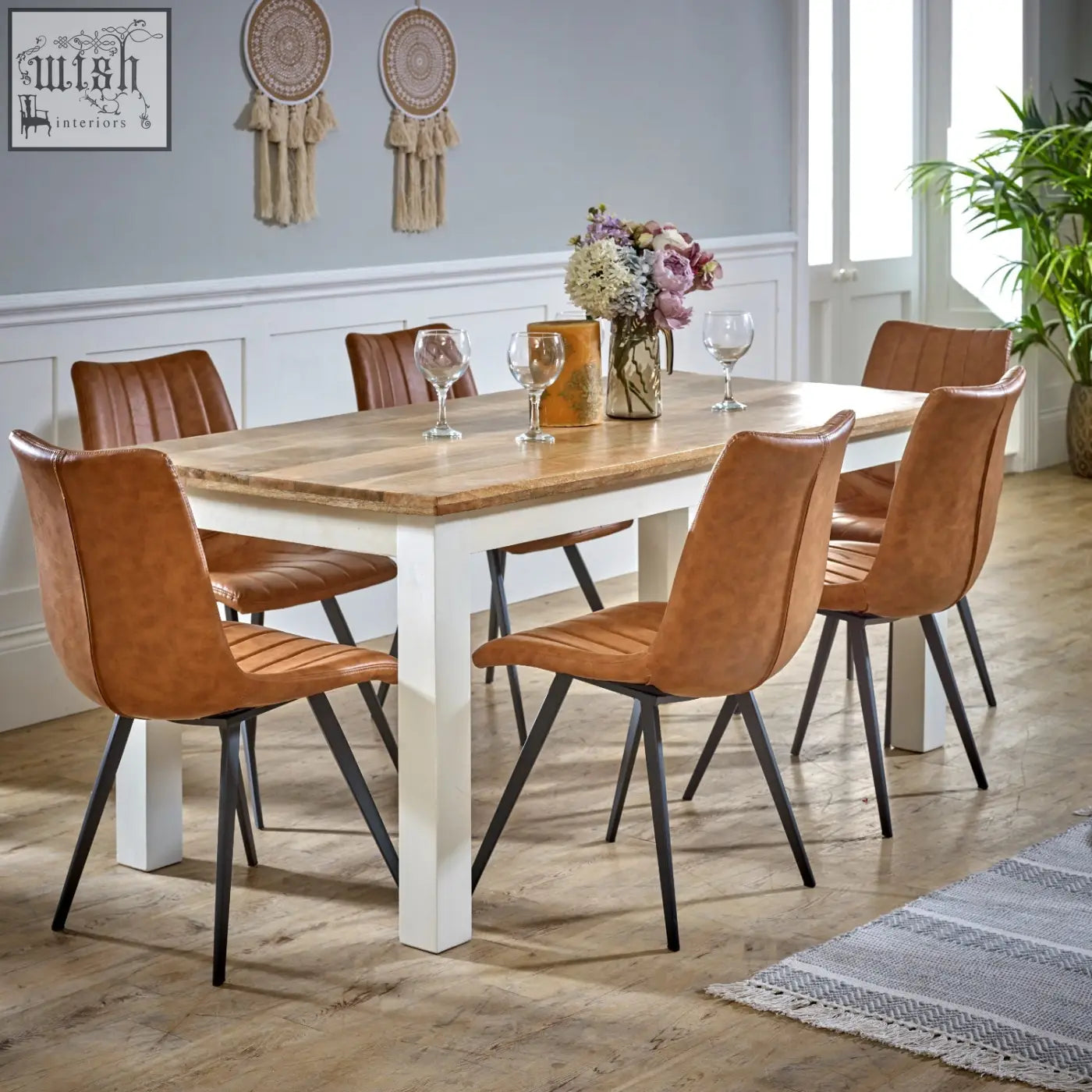 Brown leather dining chairs with black metal legs around bianco solid mango wood white dining table 170cm