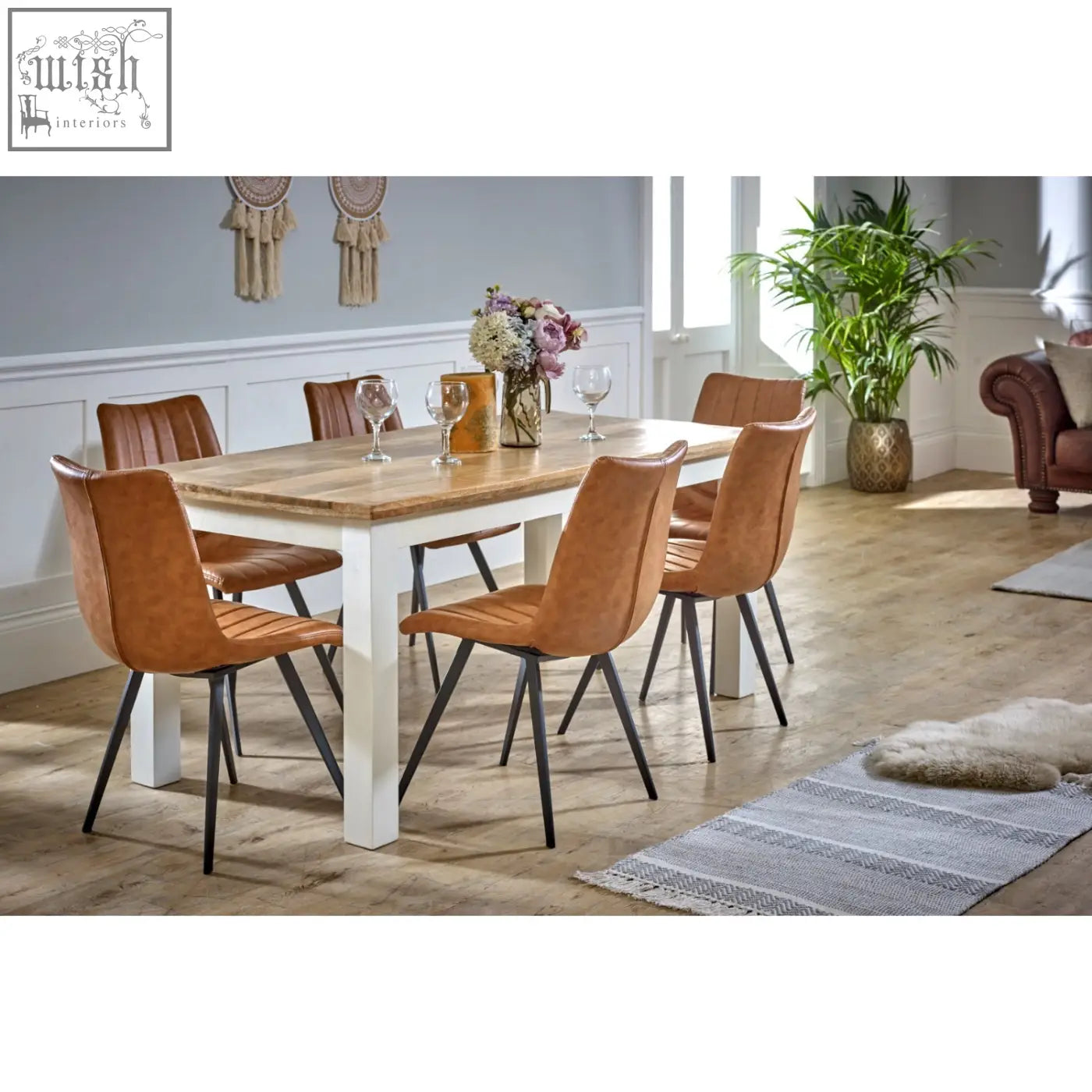 Tan leather dining chairs with black metal legs around bianco solid mango wood white dining table 170cm
