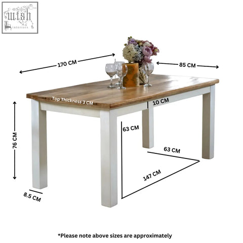 A bianco solid mango wood dining table with a light wood top and white legs measuring 170 cm long