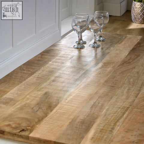 Rustic light brown bianco solid mango wood dining table countertop with natural grain and texture