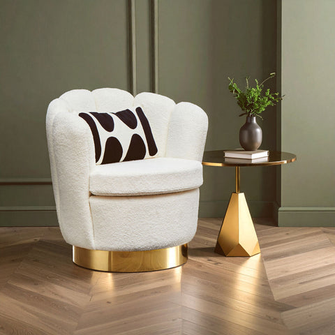 White boucle scalloped swivel chair with plush shell shape gold base and black abstract cushion for stylish comfort