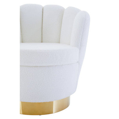 White boucle scalloped swivel chair with shell-like back and gold-tone circular base in off white upholstery