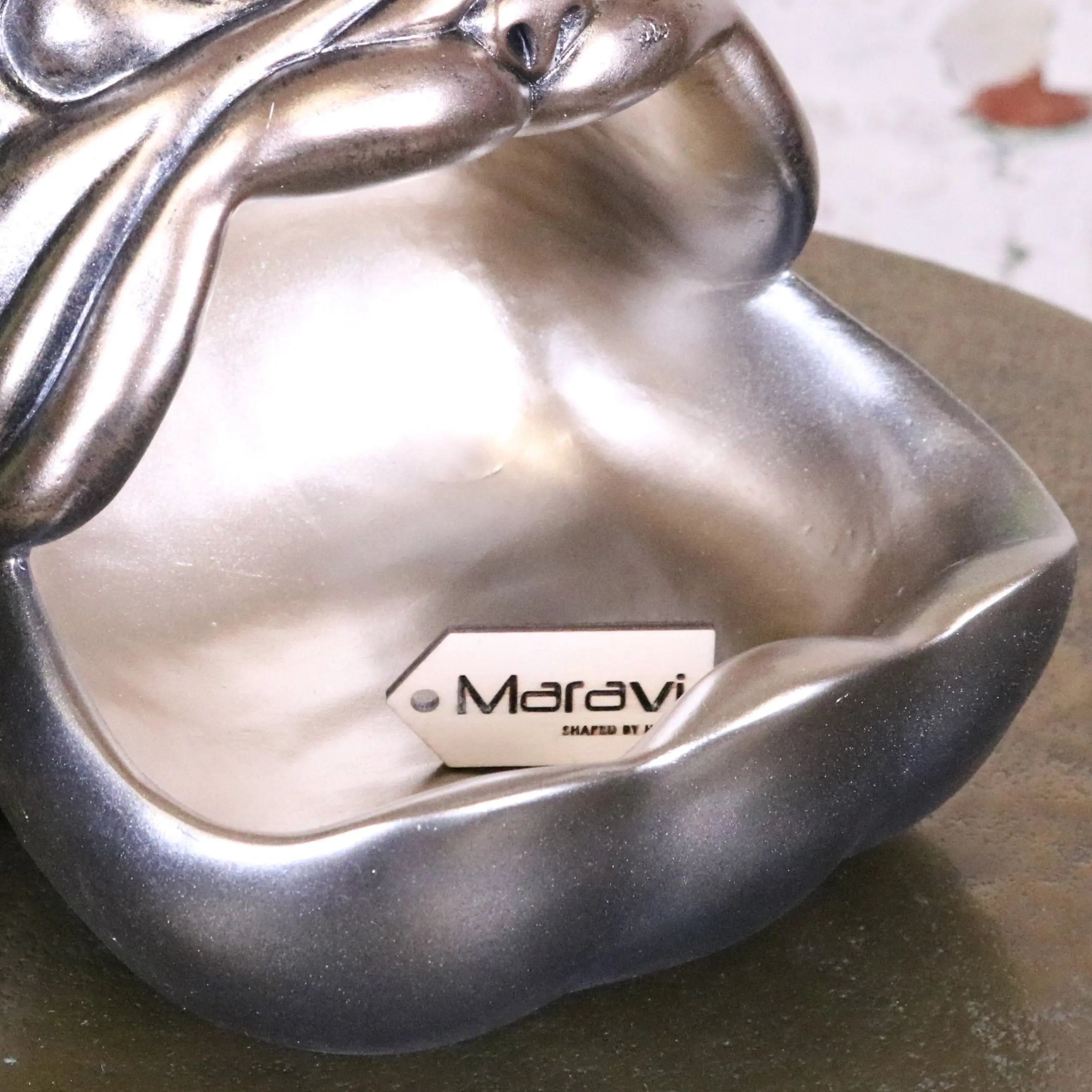 Silver metallic figurine of a woman with smooth curves on the big gob dog novelty bowl for stylish pet feeding