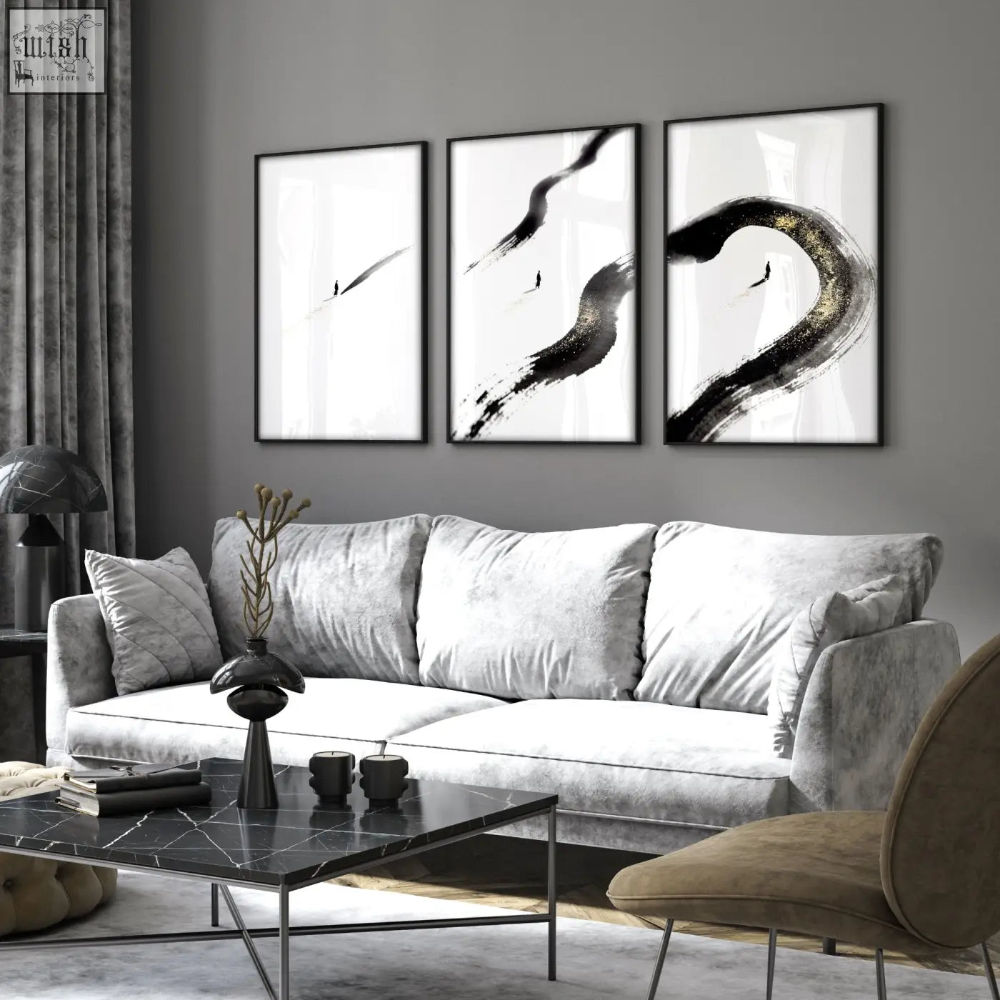 Silver velvet sofa with plush cushions in a living room featuring modern minimalist wall art set of 3