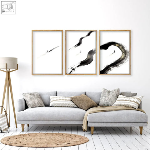 Set of three minimalist black and white brushstroke wall art pieces in light wood frames for living room wall decor