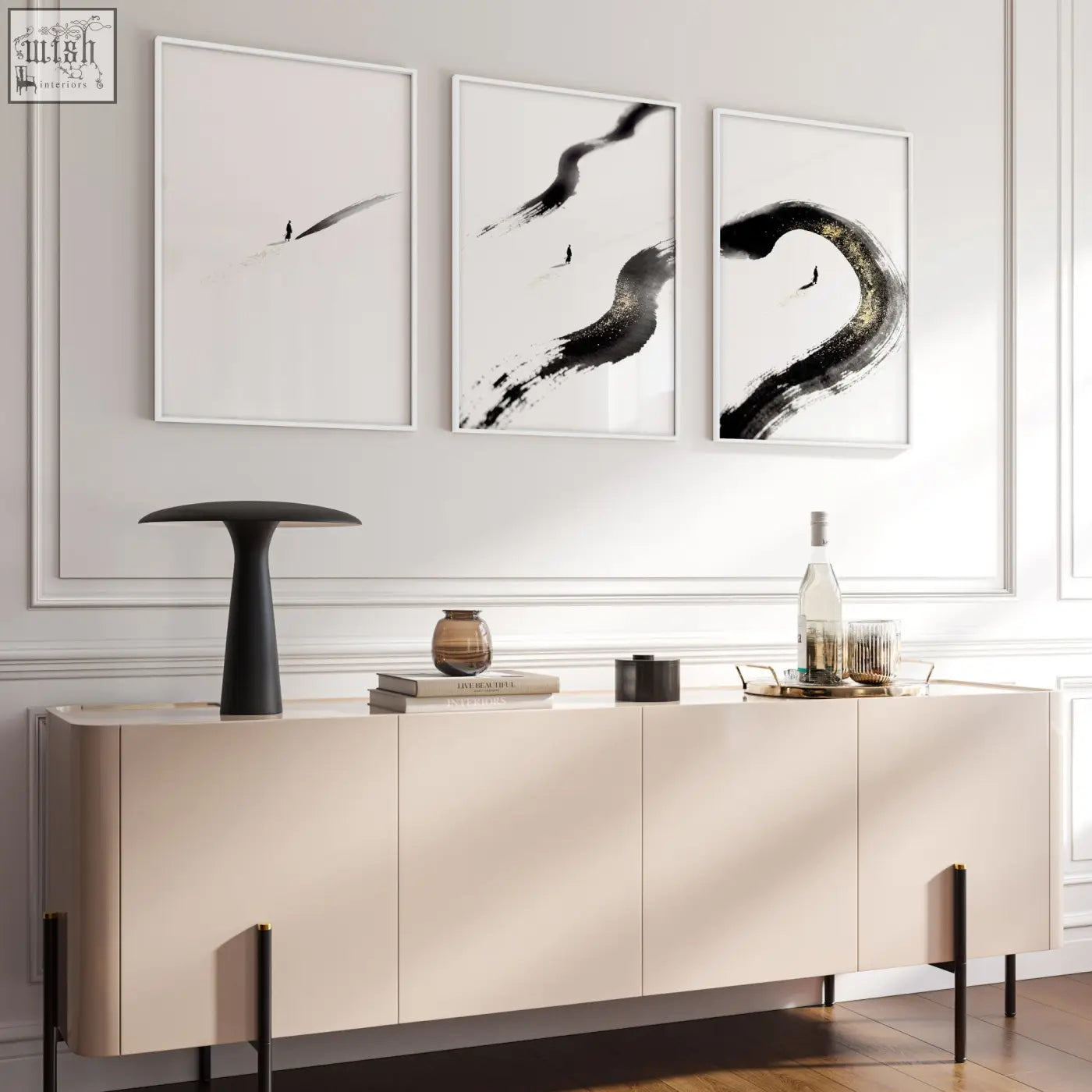 Cream-colored sideboard with sleek minimalist design and black legs in a living room with japandi zen ink brushstroke wall art set