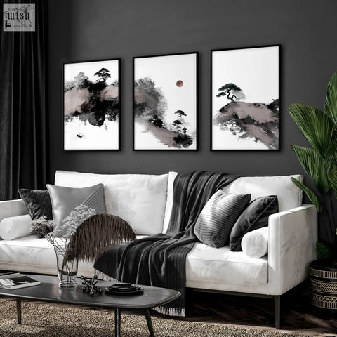 Three framed black and white japanese ink landscape big paintings hanging above a modern white sofa in living room