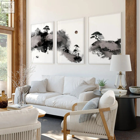 Three framed black and white japanese ink landscape art prints hang above a white sofa in living room big painting set