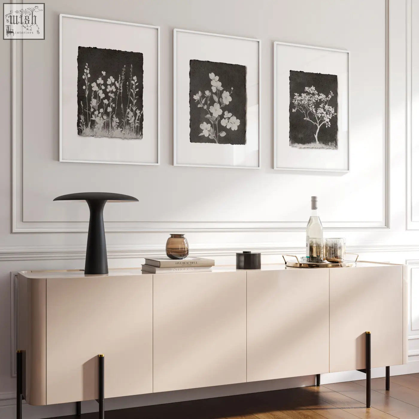 Cream-colored sideboard with sleek minimalist design and black legs below french country dark floral living room wall art set of 3