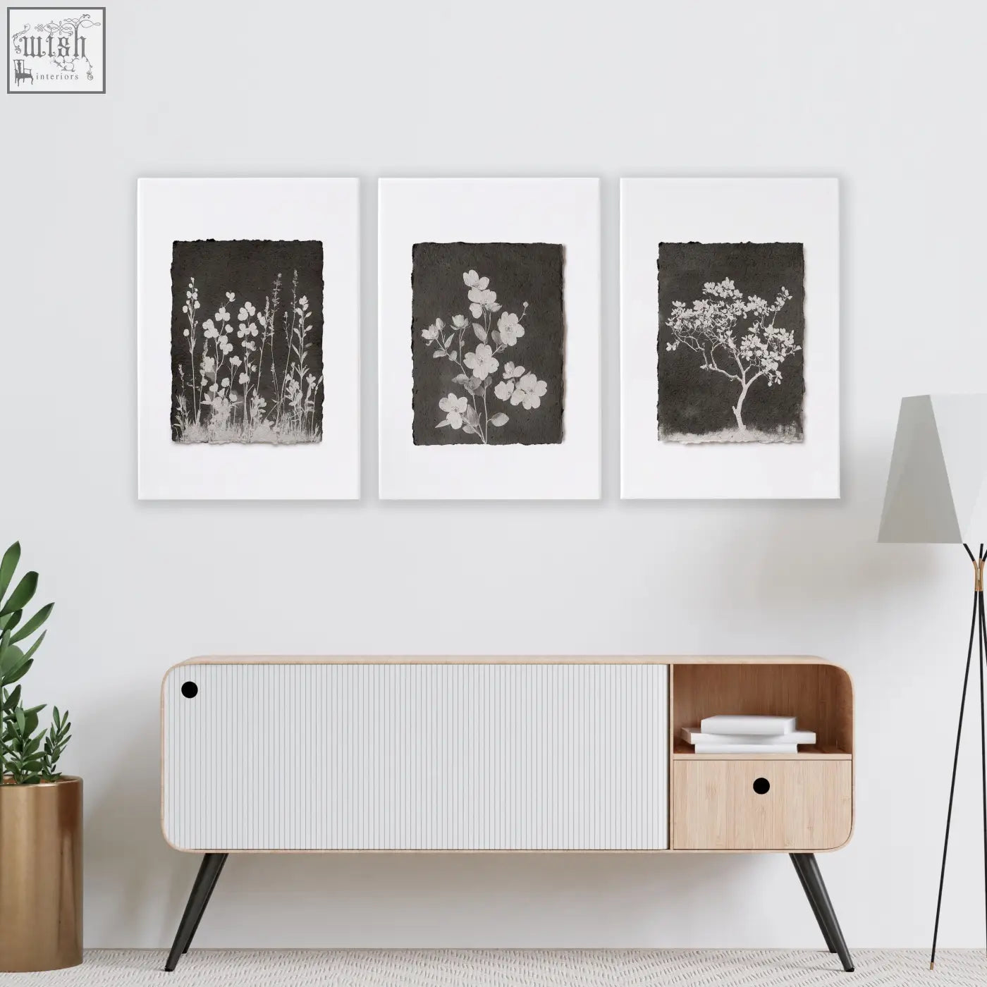 Modern minimalist sideboard with white ribbed panel and light wood accents in a living room with french country wall art