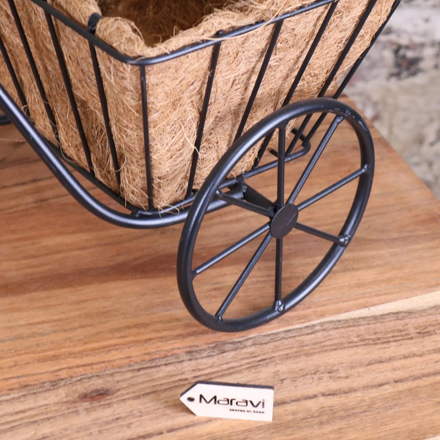 Black metal bike garden planter with woven coconut fiber basket perfect for vintage style garden planter use