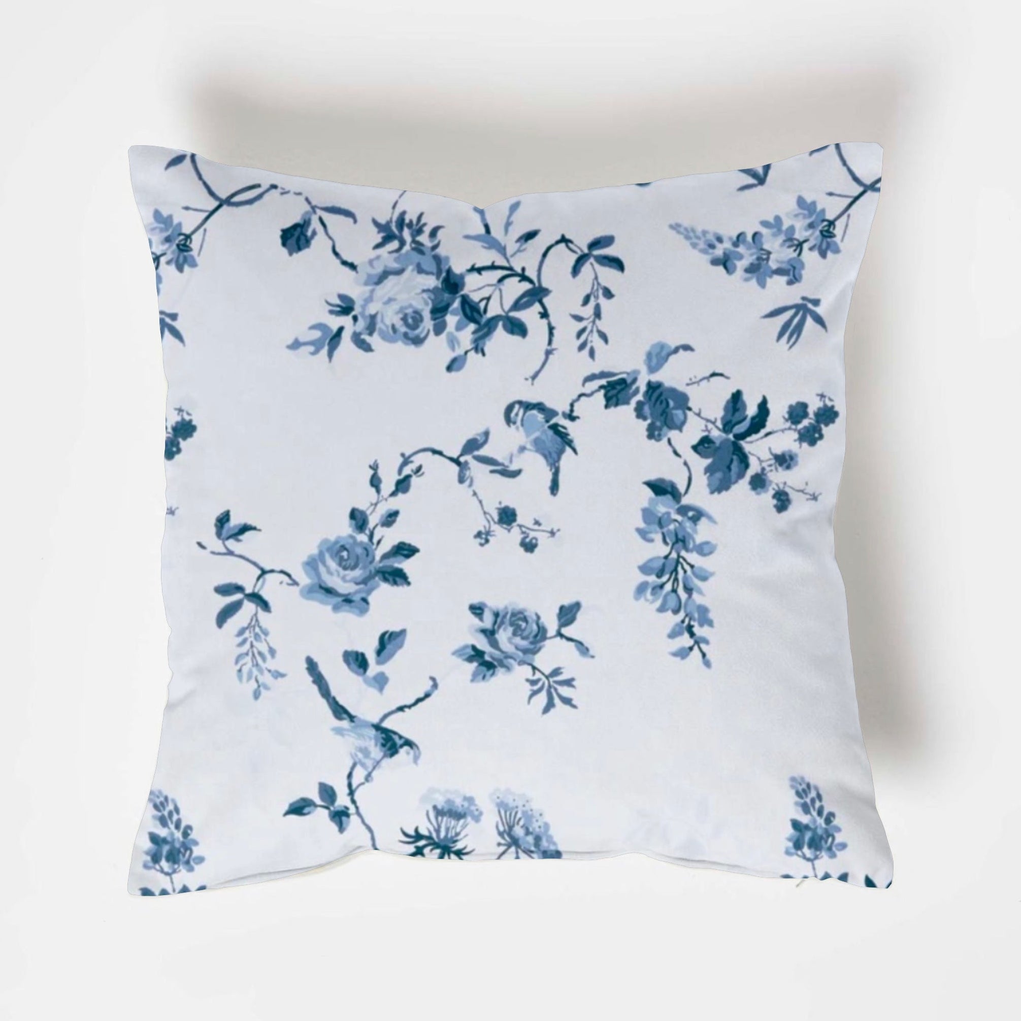 White cotton throw cushion with delicate blue roses cotton floral pattern featuring birds and vines design