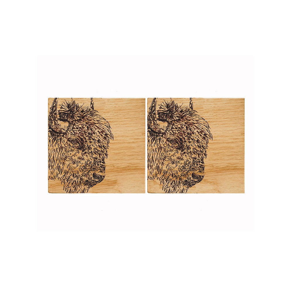 Pair of natural british oak coasters with intricately engraved bison head designs perfect for any table setting