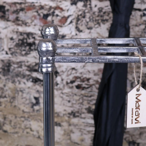 Silver-finished metal bitlan rectangular walking stick stand with rounded ball finials and rustic industrial design