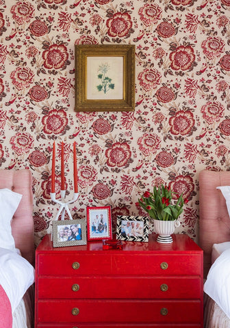 Black and brown marquetry pattern photo frame 6x4 with vibrant red lacquered dresser featuring brass knobs and distressed finish
