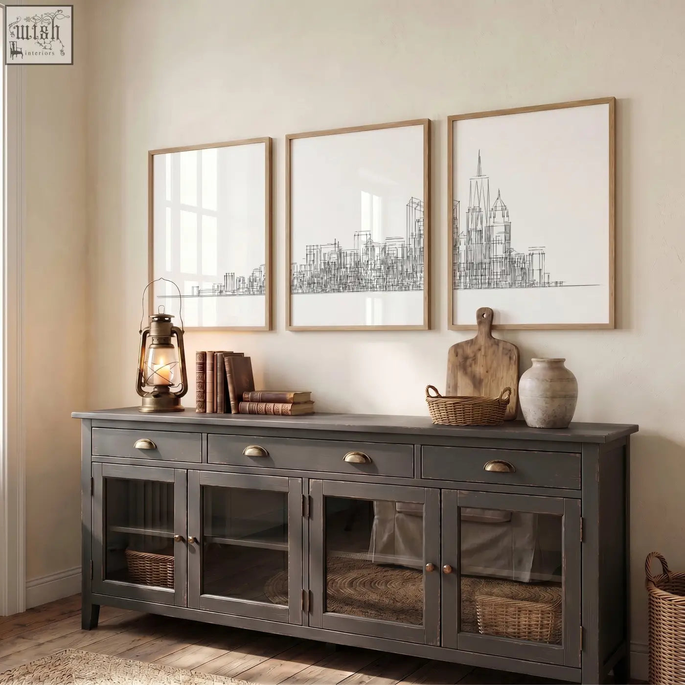 Dark gray rustic sideboard with glass-paneled doors and brass handles below white canvas three panels new york skyline line art