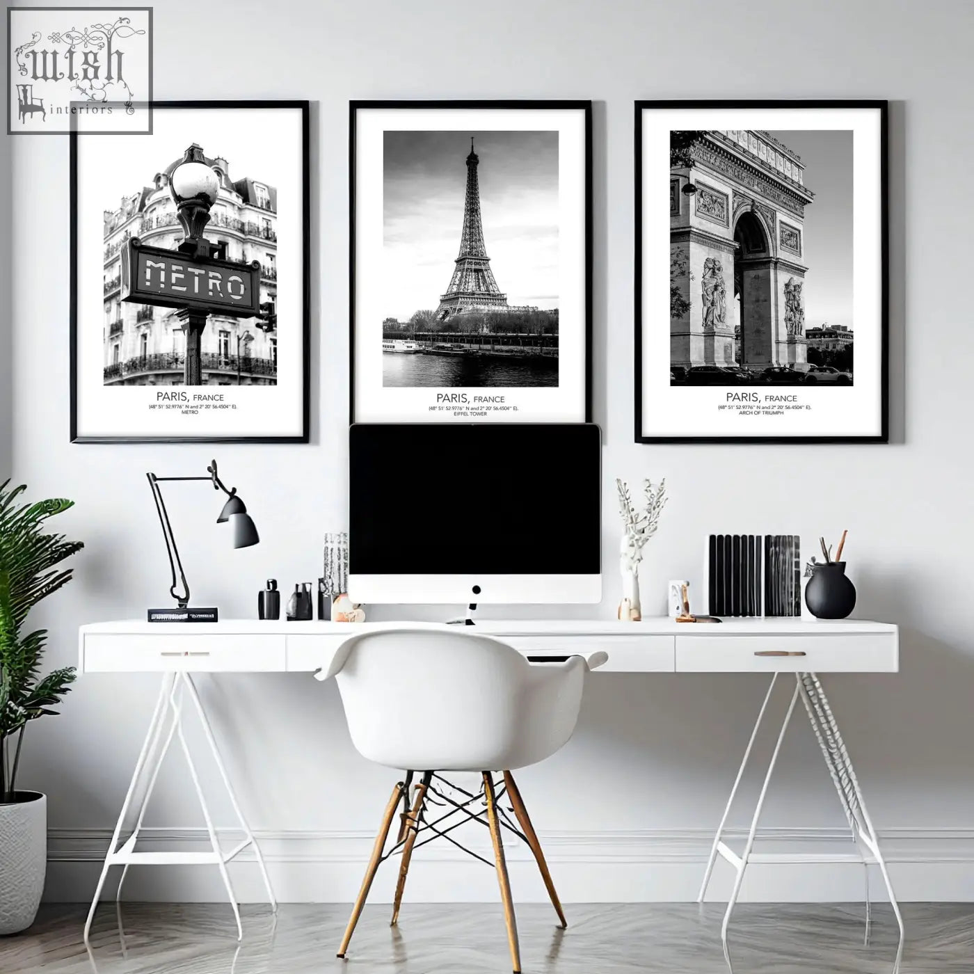 White minimalist desk with slender metal legs paired with black and white paris wall art set of 3 prints