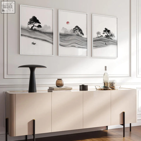 Cream-colored modern sideboard with sleek black legs paired with black and white prints featuring red moon in living room