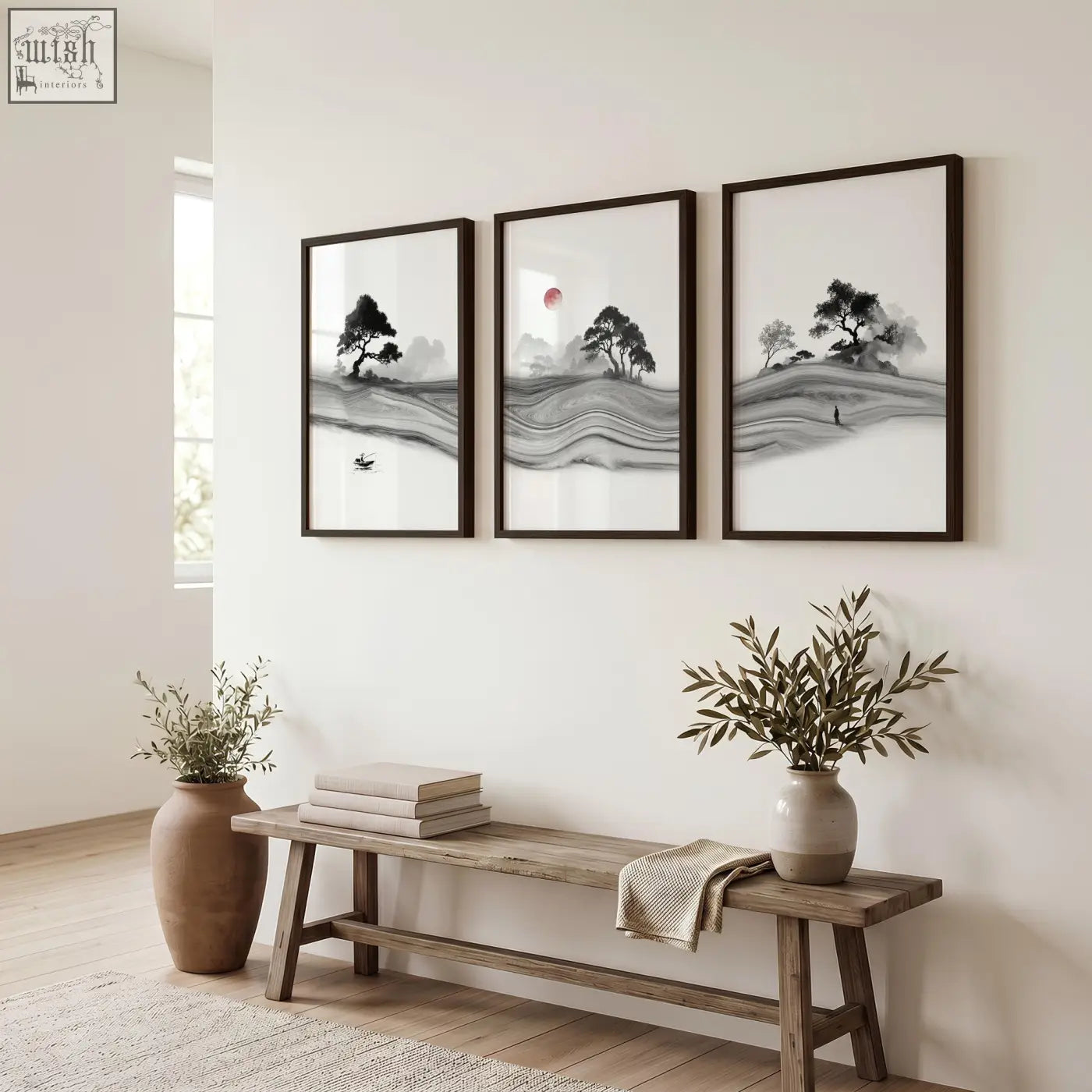 Three framed black and white prints japandi ink landscape with red sun displayed above a rustic wooden bench