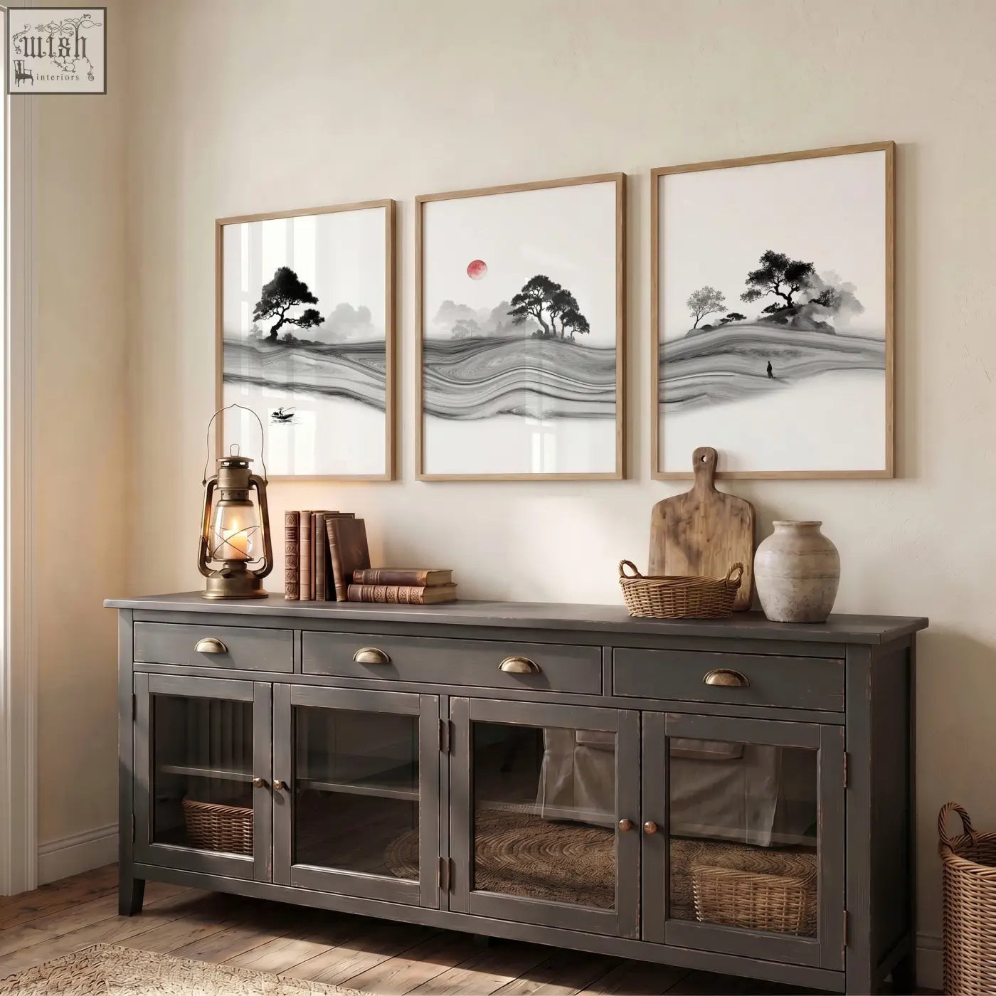 Dark gray wooden sideboard with glass doors and brass handles next to black and white prints japandi featuring red sun