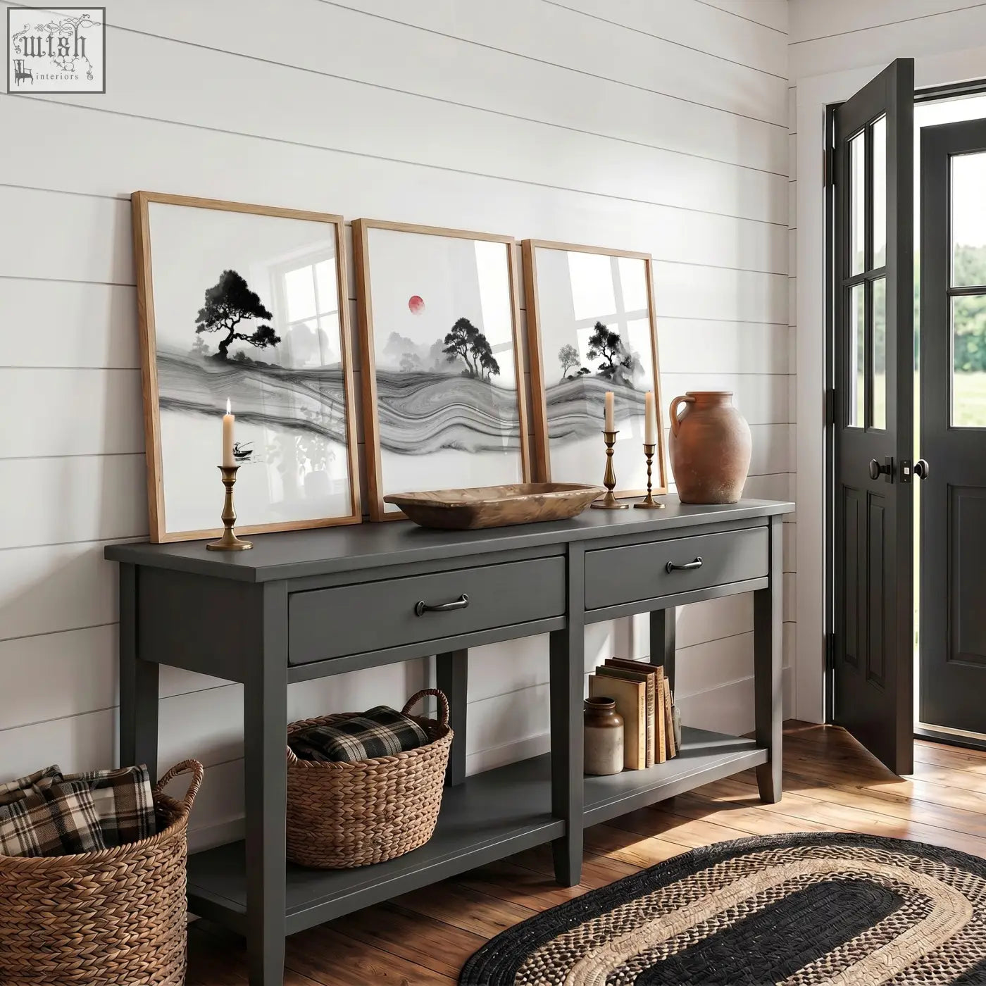 Dark gray console table with drawers and open shelving featuring rustic bowl and black and white prints japandi landscape set with red sun