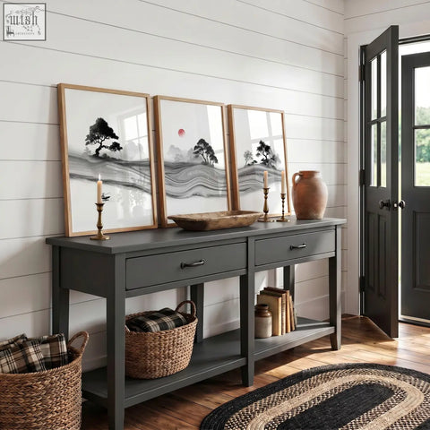 Dark gray console table with drawers and open shelving featuring rustic bowl and black and white prints japandi landscape set with red sun