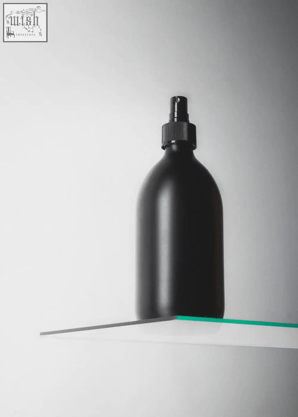 Black atomiser spray bottle with matte finish and textured black cap for easy grip and stylish use
