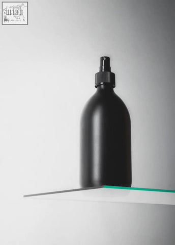 Black atomiser spray bottle with matte finish and textured black cap for easy grip and stylish use