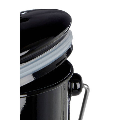 Black compost bin with handle made of black enamel-coated metal featuring a matching lid and silicone gasket