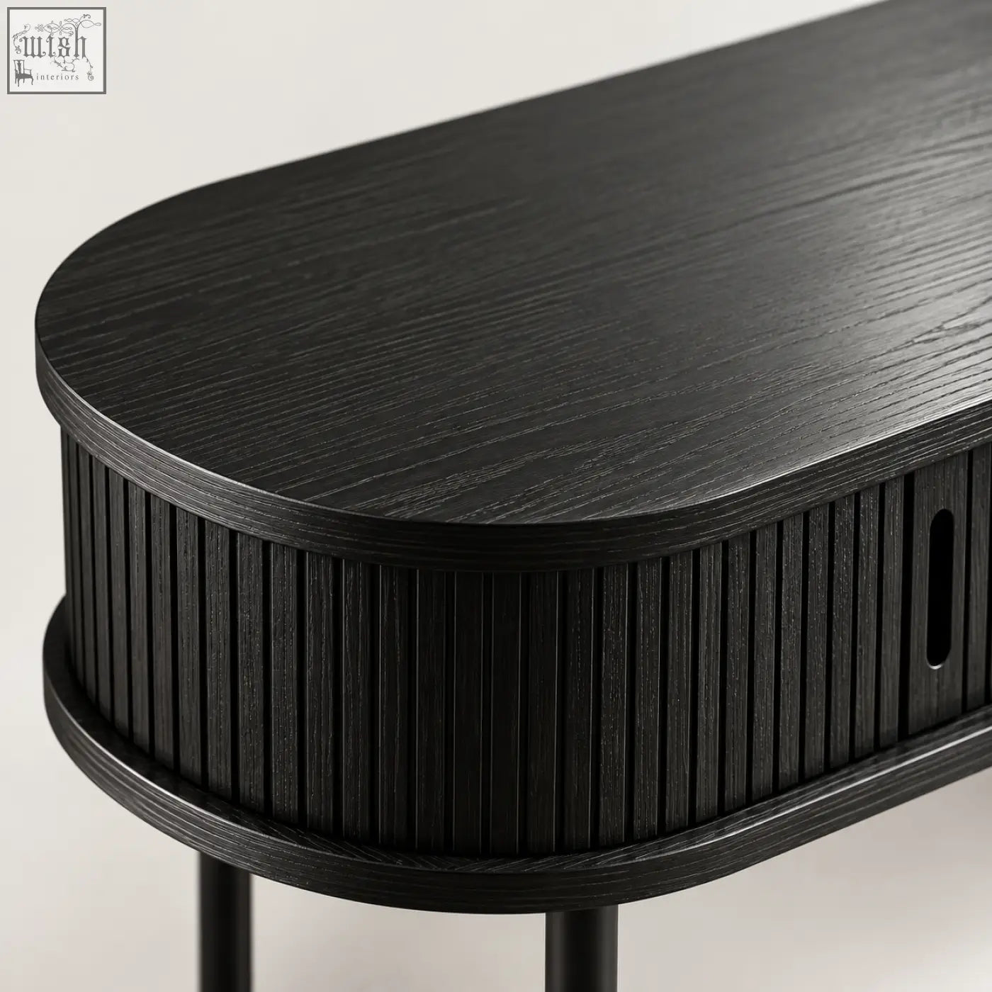 Black fluted console table with oval shape matte wood grain surface and vertical ribbed sides for stylish storage