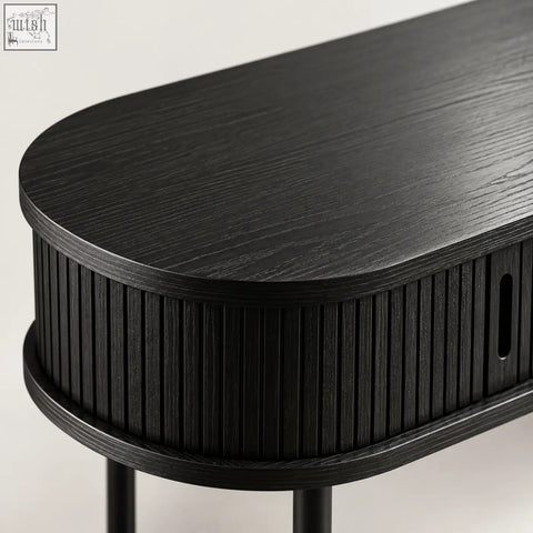 Black fluted console table with oval shape matte wood grain surface and vertical ribbed sides for stylish storage