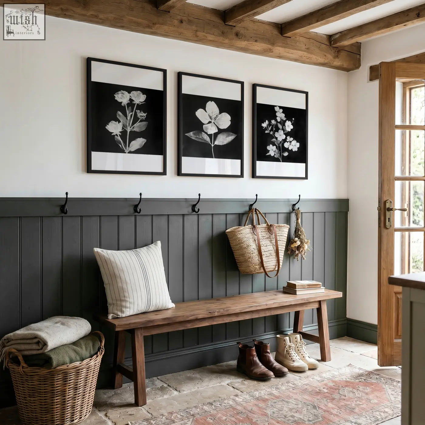 Dark gray wooden bench with striped pillow next to black framed picture set of 3 french country botanical prints