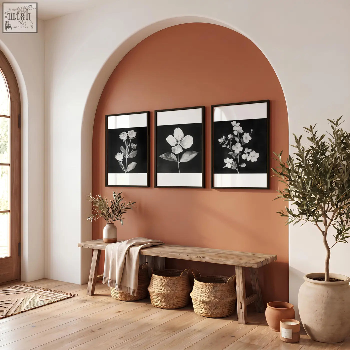 Three black framed picture botanical prints with white borders hanging on an orange arched wall in french country style